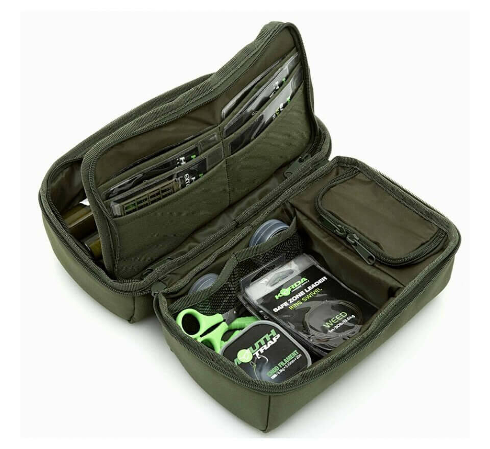 trakker-nxg-pva-pouch-205900 Une boîte à matériel bien organisée remplie d'équipements et d'outils essentiels pour la pêche à la carpe.